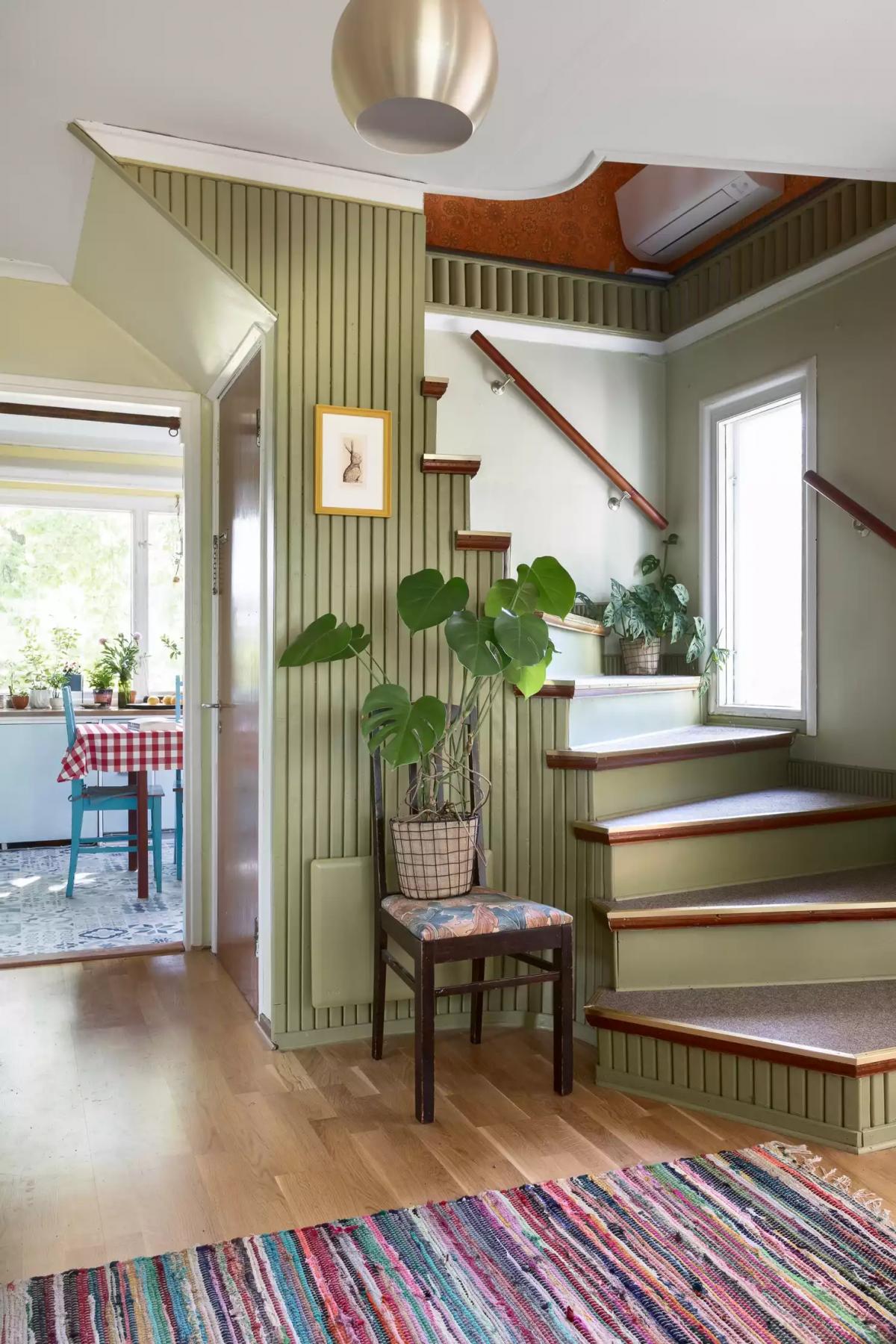 A staircase in the house painted green