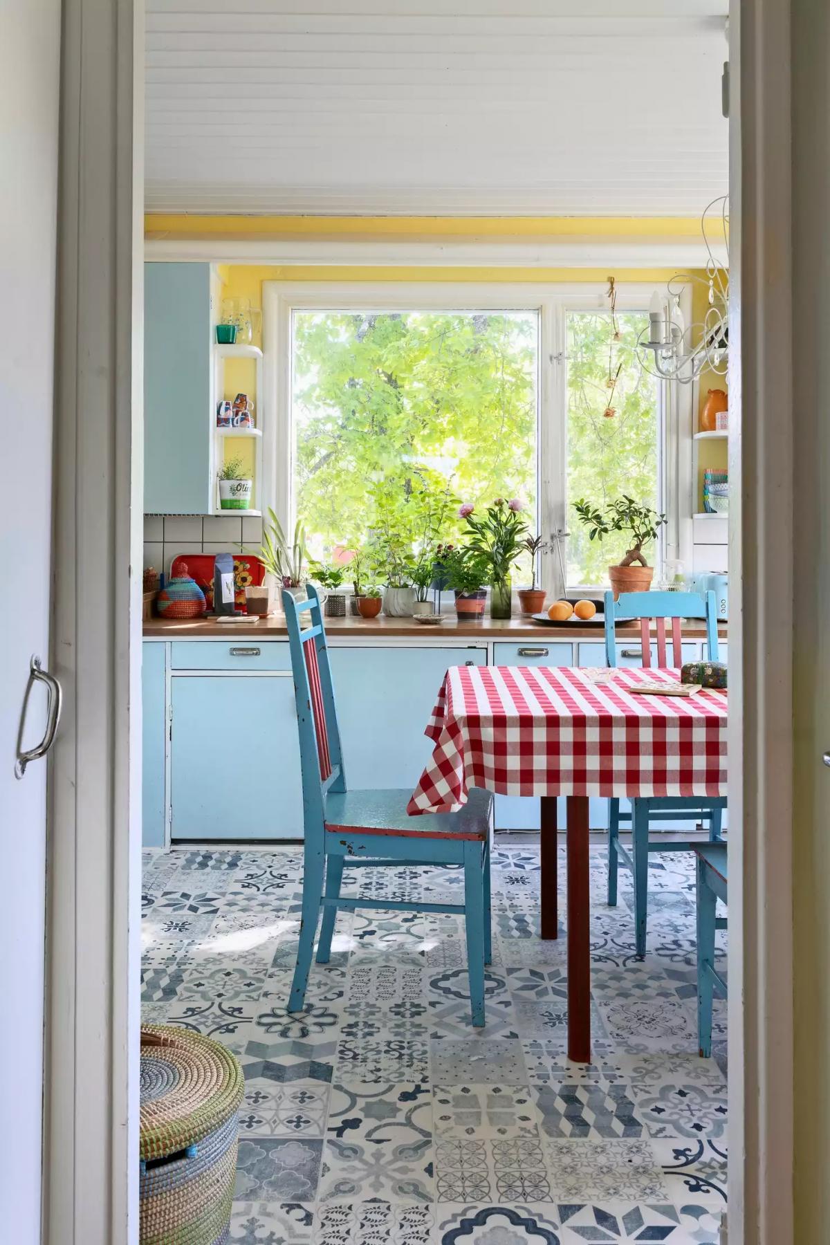 A blue kitchen in a wooden house