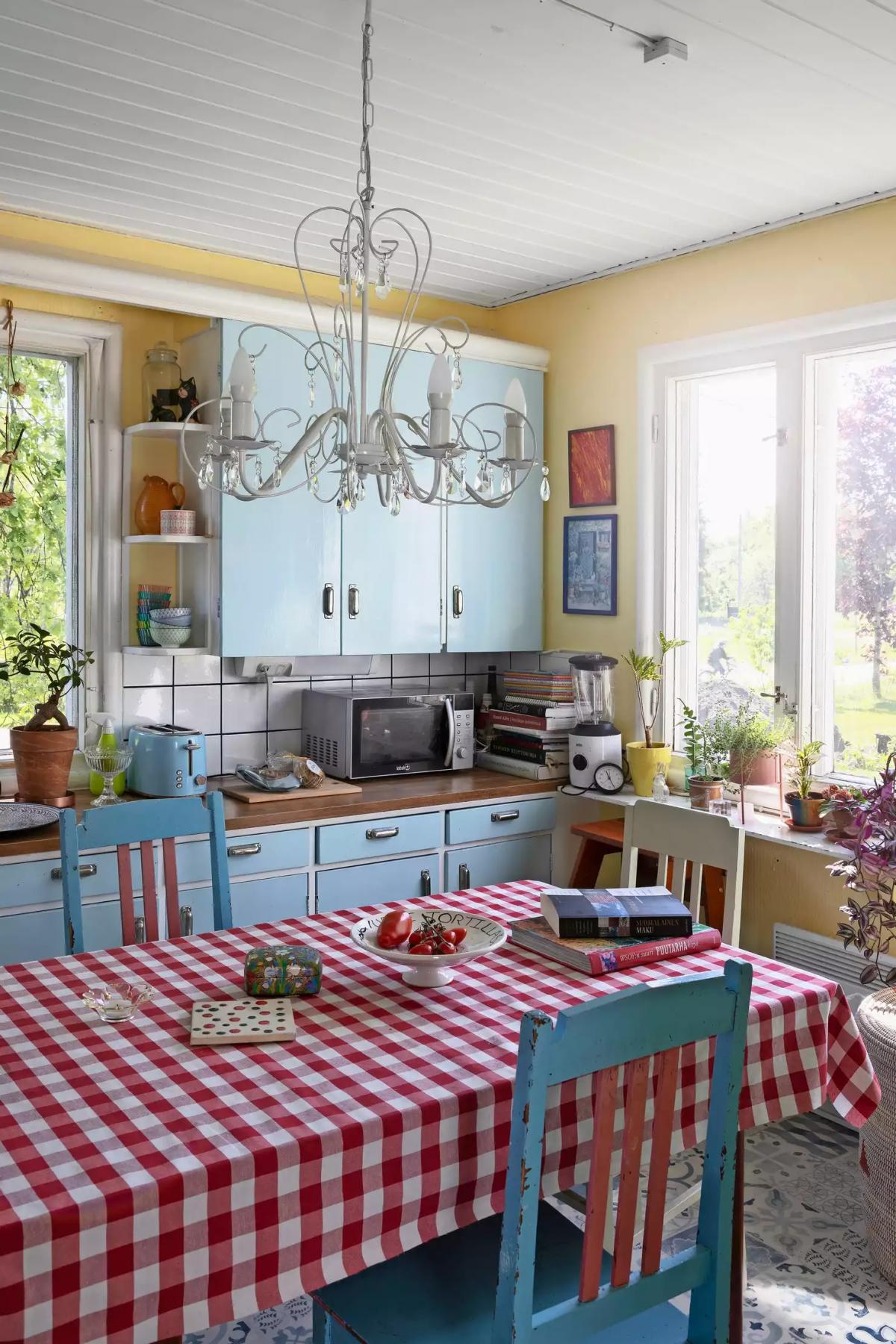 A red checkered tablecloth in the kitchen