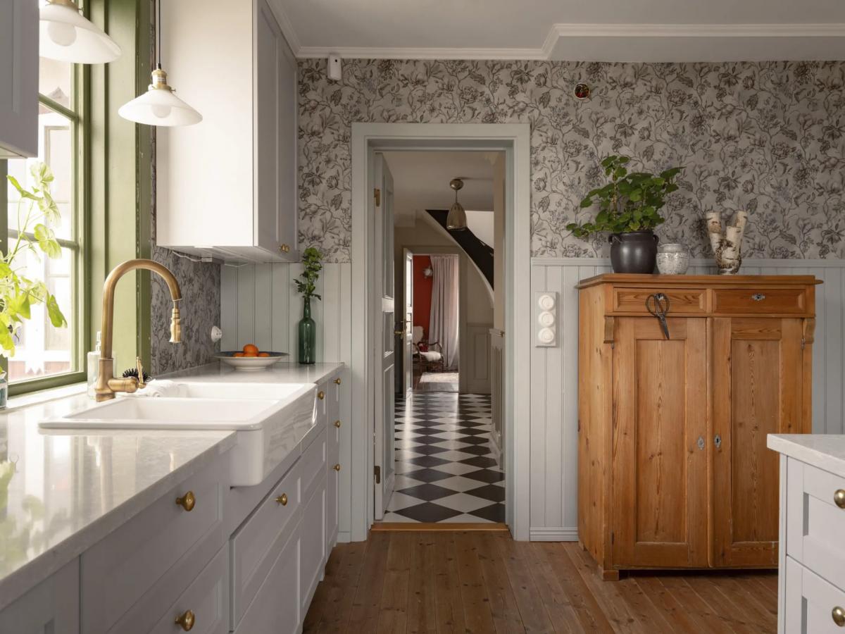 Scandinavian kitchen with floral wallpaper