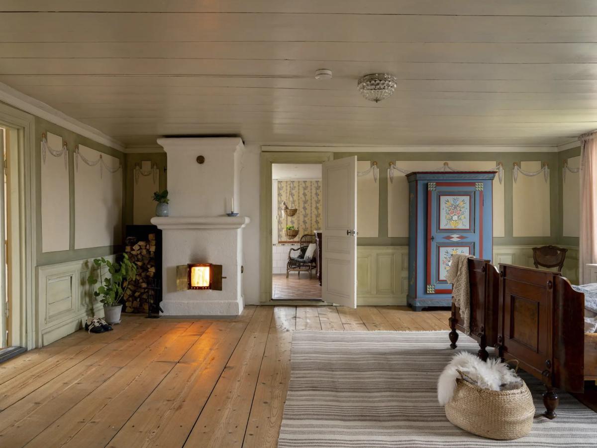 Large bedroom in the house with a stove