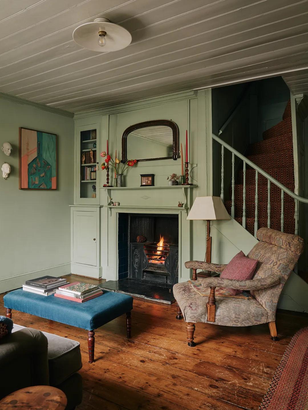 Living room with an armchair and fireplace