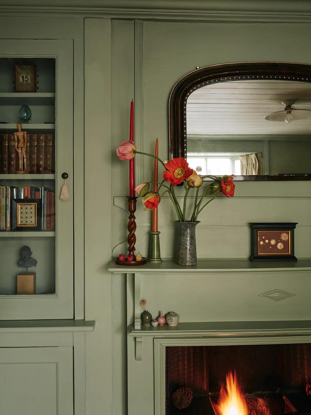 Flowers and candles above the fireplace