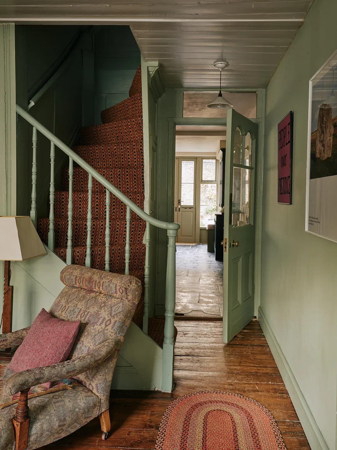 Old staircase with green railings in an English house