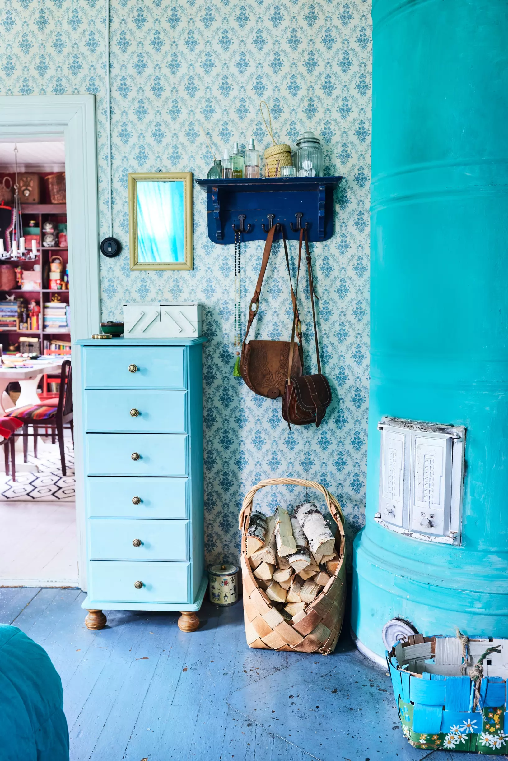 A wood-burning stove painted turquoise