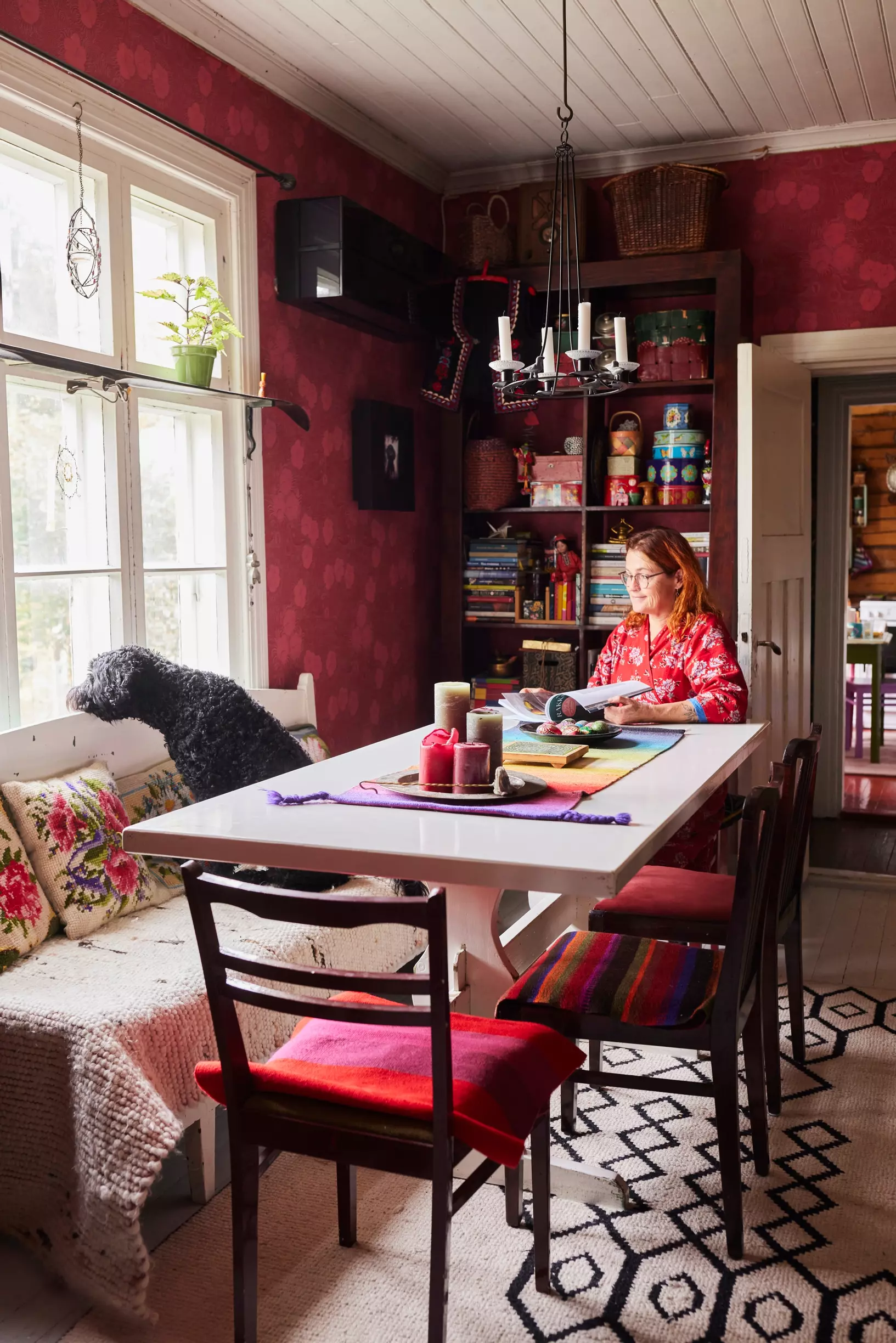 Dining area with red walls in an old Finnish home