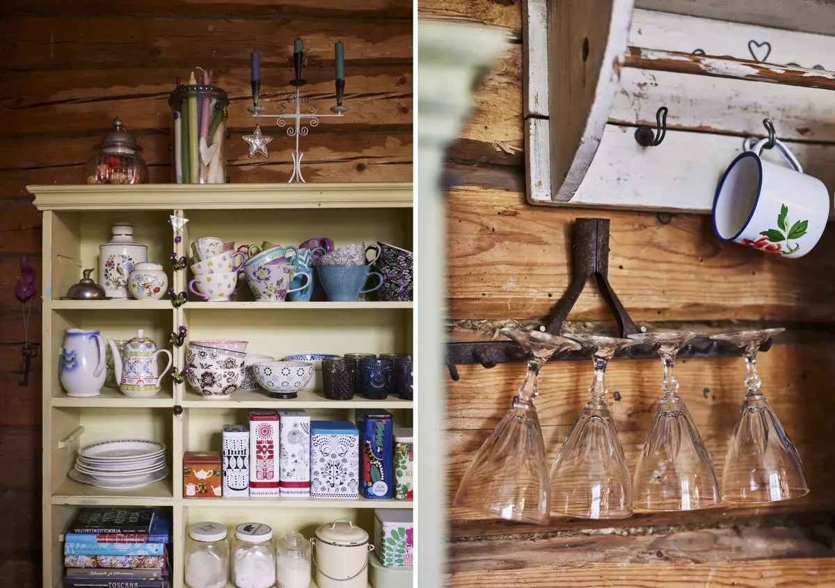 Vintage mugs and cups with colorful candles in a jar