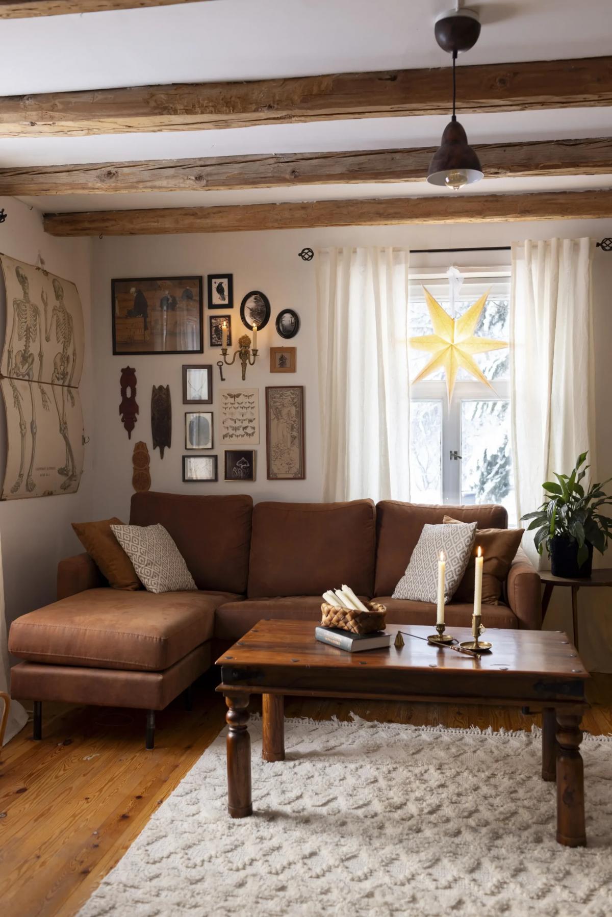 Brown sofa, retro table, and wooden floors in the living room